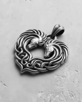 Oxidized 925 sterling silver Celtic horse heart pendant, a desaturated photo highlighting deep shadows and craftsmanship.