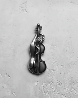 Silver violin pendant with a female nude figure design, handcrafted in 925 sterling silver, shown on a textured white surface.