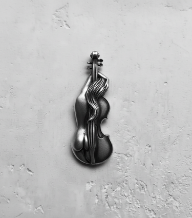 Silver violin pendant with a female nude figure design, handcrafted in 925 sterling silver, shown on a textured white surface.