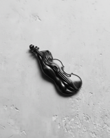 Silver Violin Pendant in black rhodium, showing the fused female figure and instrument from an elegant side angle.