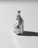 Rear view of 925 sterling silver sitting cat pendant showing textured fur details and curled tail design