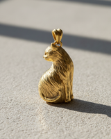 14K gold vermeil sitting cat pendant with detailed fur texture and elegant posture