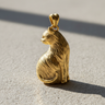 14K gold vermeil sitting cat pendant with detailed fur texture and elegant posture