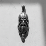 Silver Odin Pendant with an oxidized finish, showing the detailed warrior helmet and braided beard on a white wall.