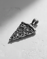 Angled view of the handcrafted silver pizza pendant showing its 3D depth, oxidized details, and sturdy bail.