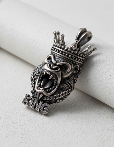 Detailed front view of the Silver King Gorilla Pendant highlighting the intricate crown and textured fur on a white background.