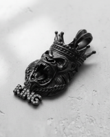 Silver King Gorilla Pendant in black rhodium, showing the roaring face and iced-out 'KING' lettering on a textured surface.