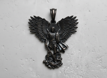 Front view of black rhodium plated sterling silver Archangel Michael pendant defeating a dragon