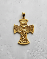Gold-plated version of the St. Michael Cross Pendant, showcasing the intricate archangel design against a white surface.