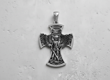 Front view of 925 sterling silver St. Michael cross pendant with oxidized finish and detailed relief