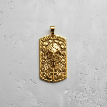 Gold vermeil Santa Muerte dog tag pendant with skull and rosary details on grey background