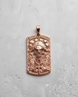 Rose gold plated silver Santa Muerte pendant in dog tag shape with praying hands and skull details on grey background