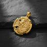 14K gold vermeil lion cross pendant with a detailed lion head and interwoven Celtic cross on a dark slate surface.