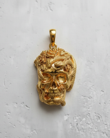 14K gold vermeil skull snake pendant with rose details, shown from the front against a textured white background.