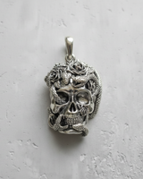 Close-up of the 925 sterling silver skull snake pendant, highlighting the handcrafted texture of the snake scales.