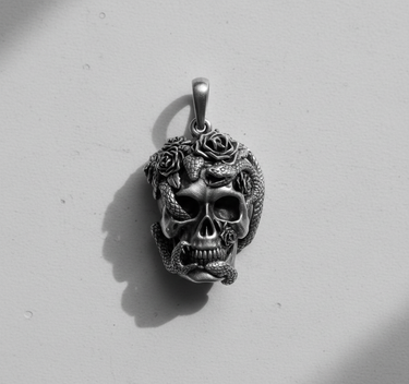 Dramatic black and white shot of the Silver Skull Snake Pendant, highlighting the intricate details and shadows of the design.