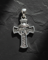 Silver Jesus Cross Pendant featuring the face of Christ with a crown of thorns and INRI inscription on a dark slate background.