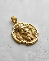 Gold-plated version of the Jesus Christ pendant, highlighting the warm tones and intricate details of the hair and beard.