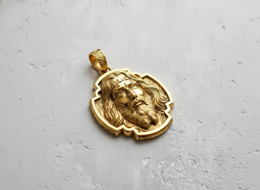 Gold-plated version of the Jesus Christ pendant, highlighting the warm tones and intricate details of the hair and beard.