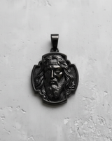 Black rhodium-plated silver Jesus pendant shown from above, highlighting the dark, polished finish on a white background.