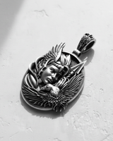Oxidized 925 sterling silver Valkyrie pendant with a winged warrior, eagle, and spear detail on a textured white surface.