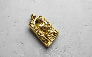 Gold vermeil Viking warrior pendant featuring high relief sculpture and runic symbols on textured background