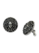 A dynamic shot of the Medusa 925 silver cufflinks pair, highlighting the oxidized finish and detailed facial features.