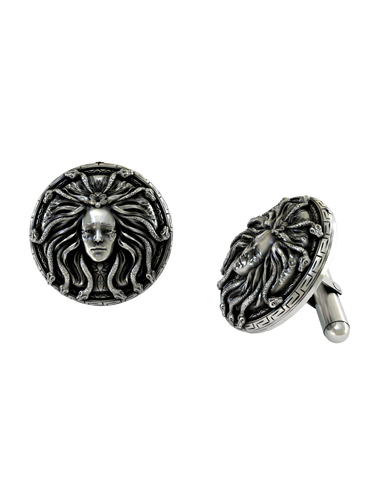A dynamic shot of the Medusa 925 silver cufflinks pair, highlighting the oxidized finish and detailed facial features.