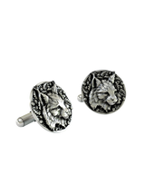 A macro close-up of a Silver Lynx Cufflink, emphasizing the fine details in the fur, tufted ears, and surrounding acorns.