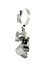 A person wearing the 925 sterling silver Abstract Face Earring as a bold, surrealist statement piece.