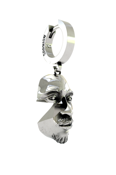 A person wearing the 925 sterling silver Abstract Face Earring as a bold, surrealist statement piece.