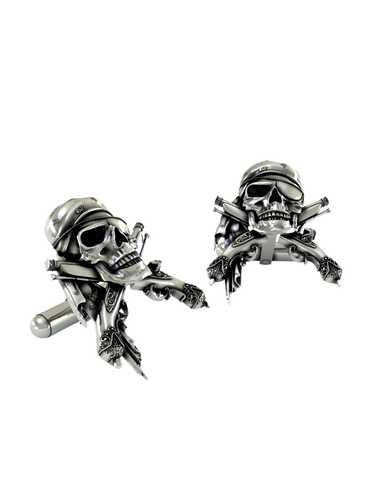 An extreme close-up of a Pirate Skull Cufflink, emphasizing the fine details on the bandana and the engravings on the pistols.