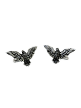 An extreme close-up of a Silver Eagle Cufflink, emphasizing the intricate texture and layers of the sculpted feathers.