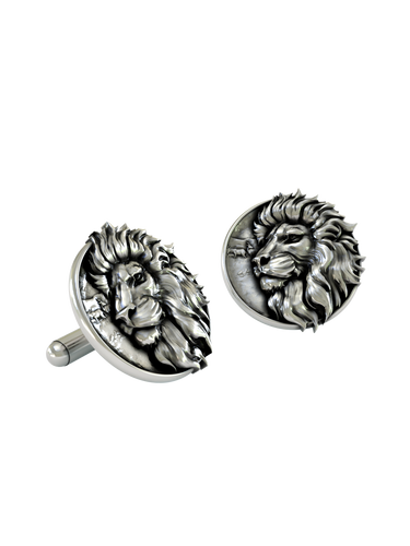 An extreme close-up of a Silver Lion Cufflink, emphasizing the intricate details of the mane and the savanna scene.