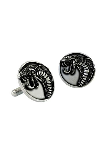 An extreme close-up of a sterling silver Snake Cufflink, emphasizing the lifelike texture of the scales and the polished fangs.