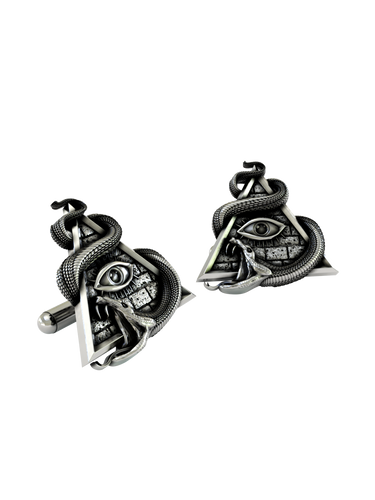 An extreme close-up of an All-Seeing Eye Cufflink, emphasizing the fine details of the snake's scales and the textured pyramid.