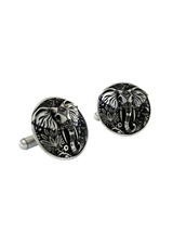 An extreme close-up of an Ornate Elephant Cufflink, emphasizing the fine, henna-like patterns on the elephant's head and trunk.