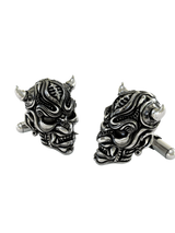 Angled view of the Samurai Oni mask sterling silver cufflinks pair, highlighting the intricate layers and oxidized details on the armor.