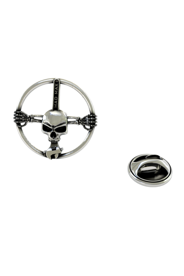 Back of the Mad Max Skull Pin showing the pin post and the separate butterfly clutch backing.