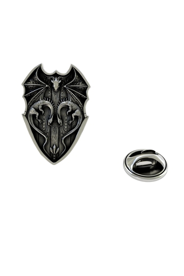 Back of the Silver Dragon Shield Lapel Pin showing the pin post and the separate butterfly clutch backing.

