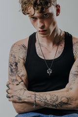 Back view of the Dragon Love Pendant, showcasing the solid silver construction and intertwined tails.