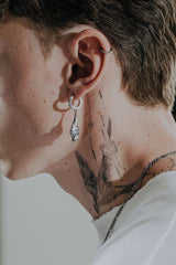 Back view of the Hanging Bat Earring displaying the polished hoop with the 925 hallmark and SARNION brand stamp