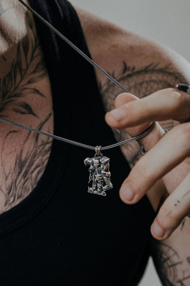 Back view of the Military Hero Pendant showcasing the solid silver construction and sculptural depth.