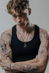 Back view of the Odin Ravens Pendant, showcasing the solid silver construction and the reverse of the ravens.