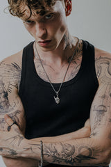 Back view of the Rock Skull Pendant, showcasing the solid silver construction of the hand and skull.