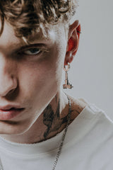 Back view of the Uzi Rifle Earring displaying the polished hoop with the 925 hallmark and SARNION brand stamp