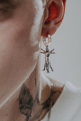 Back view of the Vitruvian Man Earring displaying the polished hoop with the 925 hallmark and SARNION brand stamp