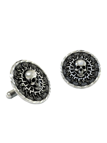 Black Sun Skull Cuffs shown on a shirt cuff to demonstrate their actual size and powerful, mystical appearance when worn.