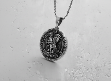 Oxidized silver Saint George pendant shown on a matching chain, demonstrating its wearability as a religious necklace.