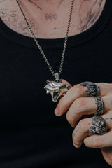 Cat School Pendant inspired by The Witcher - front view of the geometric, snarling cat head in sterling silver